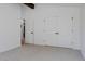 Bedroom with carpeted floors features white walls and closet at 2415 Urban St, Lakewood, CO 80215