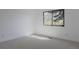 Cozy bedroom with carpeted floors has a window and white walls at 2415 Urban St, Lakewood, CO 80215