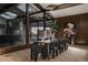 Modern dining room with wood table, large glass window views and stylish accents at 2415 Urban St, Lakewood, CO 80215