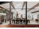 Open floor plan with view of the dining and kitchen area, framed by large glass windows at 2415 Urban St, Lakewood, CO 80215