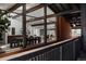 Open dining room has wood floors, wood beams, large windows and plenty of natural light at 2415 Urban St, Lakewood, CO 80215