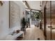 Hallway boasts hardwood floors, wood-paneling, natural light, and elegant decor at 2415 Urban St, Lakewood, CO 80215
