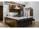 Bright kitchen with sleek white countertops, wood cabinets, stainless steel appliances and modern lighting at 2415 Urban St, Lakewood, CO 80215
