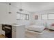 Open studio layout featuring a bed, sofa, and eat-in kitchen with modern finishes at 2415 Urban St, Lakewood, CO 80215