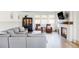 Cozy living room featuring a fireplace, large windows, hardwood floors, and comfortable seating at 1221 W 144Th Ct, Westminster, CO 80023