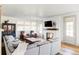 Bright living room features hardwood floors, a fireplace, and comfortable seating at 1221 W 144Th Ct, Westminster, CO 80023