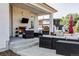 Outdoor patio featuring a brick fireplace, comfortable seating, and stylish decor at 1221 W 144Th Ct, Westminster, CO 80023