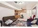 Basement featuring a seating area, storage cabinets, and a service area at 7146 Jennie Dr, Denver, CO 80221