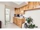 Basement service area featuring cabinets, counter space, and a view into the bathroom at 7146 Jennie Dr, Denver, CO 80221