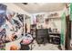 Bedroom shows decorations with posters, dresser, and closet with assorted items at 7146 Jennie Dr, Denver, CO 80221