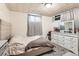 Bedroom with neutral decor, plush carpeting, and a full dresser with a mirror at 7146 Jennie Dr, Denver, CO 80221