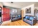 Cozy living room with hardwood floors, comfortable seating, and a warm color palette, creating an inviting space at 7146 Jennie Dr, Denver, CO 80221
