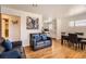 Comfortable living room with hardwood floors, stylish sofas, bright lighting, and an inviting atmosphere at 7146 Jennie Dr, Denver, CO 80221