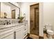 Chic bathroom featuring granite countertops, a vessel sink, a framed shower and modern fixtures at 7390 Sagebrush Dr, Parker, CO 80138