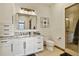 Modern bathroom with granite counters, white cabinets, and a glass-enclosed shower for a luxurious experience at 7390 Sagebrush Dr, Parker, CO 80138
