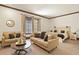 Cozy bedroom showcases a seating area with matching sofas and a comfortable bed with wood frame at 7390 Sagebrush Dr, Parker, CO 80138