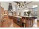 Gourmet kitchen featuring professional appliances, granite countertops, and a large island at 7390 Sagebrush Dr, Parker, CO 80138