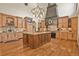 Beautiful kitchen with a center island, granite counters, and custom cabinetry at 7390 Sagebrush Dr, Parker, CO 80138