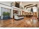 Open kitchen and bar area featuring hardwood floors and lots of natural light at 7390 Sagebrush Dr, Parker, CO 80138