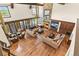 Elegant living room featuring a stone fireplace, hardwood floors, and lots of seating at 7390 Sagebrush Dr, Parker, CO 80138