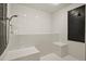 Modern walk-in shower with white subway tile, a sleek fixture, and built in seat at 7390 Sagebrush Dr, Parker, CO 80138