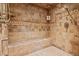 A beautiful tile shower with built in seat and detailed trim at 7390 Sagebrush Dr, Parker, CO 80138