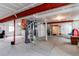 Unfinished basement with painted concrete floors, exposed ceiling, and mechanicals at 5540 Palomino Way, Frederick, CO 80504