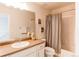 Bathroom featuring a vanity, mirror, and shower with curtain at 5540 Palomino Way, Frederick, CO 80504