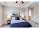 Comfortable bedroom with tray ceiling, showing the ensuite Primary bath and closet spaces at 5540 Palomino Way, Frederick, CO 80504