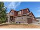 Charming two-story home with brick accents, attached garage, and a well-manicured lawn at 5540 Palomino Way, Frederick, CO 80504