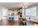 Charming kitchen with stainless steel appliances, granite countertops, and a breakfast bar with chairs at 5540 Palomino Way, Frederick, CO 80504