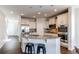 Modern kitchen with granite countertops, stainless steel appliances, and ample cabinet space for storage at 5540 Palomino Way, Frederick, CO 80504