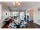 Inviting living room featuring high ceilings, modern lighting, and a cozy fireplace for relaxation at 5540 Palomino Way, Frederick, CO 80504