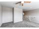 Bright and airy loft with neutral carpet and white trim details at 5540 Palomino Way, Frederick, CO 80504