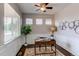 Cozy office space with natural light, stylish decor, and hardwood floors perfect for remote work at 5540 Palomino Way, Frederick, CO 80504