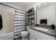 The bathroom has modern fixtures, a tub, and a stylish shelf for storage at 7710 W 87Th Dr # K, Arvada, CO 80005