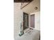 Charming condo entryway with 'HOME' welcome mat and tasteful decor at 7710 W 87Th Dr # K, Arvada, CO 80005