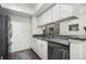 Well-lit kitchen with stainless steel appliances, light cabinets, and gray countertops at 7710 W 87Th Dr # K, Arvada, CO 80005