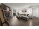 Cozy living room with a stone fireplace and large sectional sofa at 7710 W 87Th Dr # K, Arvada, CO 80005