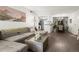 Spacious open-concept design connecting the living room to the dining area at 7710 W 87Th Dr # K, Arvada, CO 80005