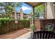 Cozy fenced-in patio with chairs and lush landscaping at 7710 W 87Th Dr # K, Arvada, CO 80005