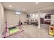 Spacious basement with carpeted floors, a gray sofa, and lots of play space at 4196 S Reading Way, Denver, CO 80237