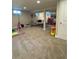 Finished basement with a play area, home gym, and comfortable seating at 4196 S Reading Way, Denver, CO 80237