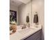 Modern bathroom featuring a sleek vanity, stylish mirror, and contemporary fixtures at 4196 S Reading Way, Denver, CO 80237