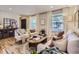 Bright and inviting living room with hardwood floors, stylish decor, and ample natural light at 4196 S Reading Way, Denver, CO 80237