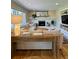 Cozy living room with a fireplace, built-in shelving, and a rustic console table at 4196 S Reading Way, Denver, CO 80237