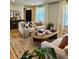 Bright living room featuring stylish furniture, a patterned rug, and lots of natural light at 4196 S Reading Way, Denver, CO 80237