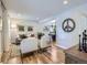Bright and open living room with hardwood floors flowing into an adjacent dining area at 4196 S Reading Way, Denver, CO 80237