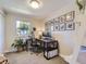 Home office with dual monitors, a comfortable chair, and bright natural light at 4196 S Reading Way, Denver, CO 80237