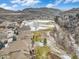Scenic aerial view of the neighborhood highlighting nearby golf course, green spaces, and mountain views at 16323 River Haven Way, Morrison, CO 80465